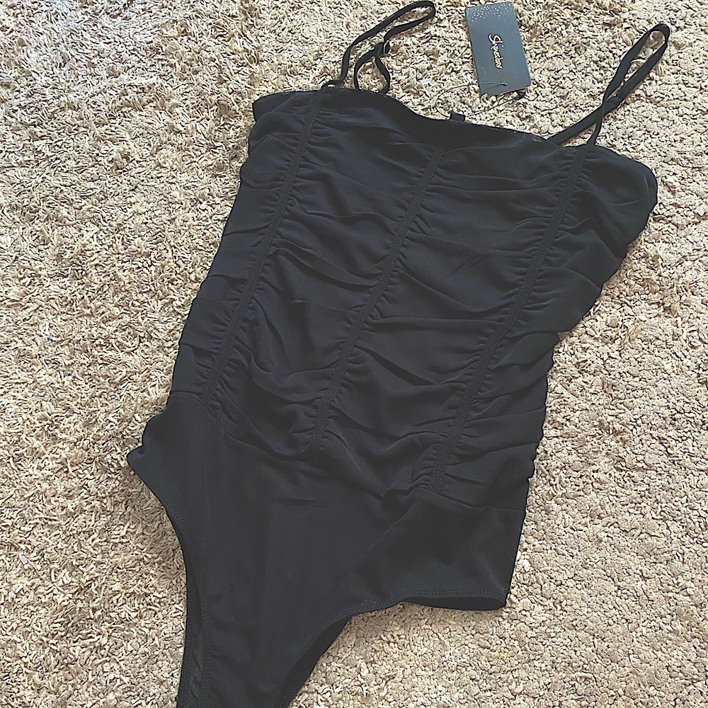 Womens black sheer body suit w/ ruffle detail on front- Size LG- new with tags!